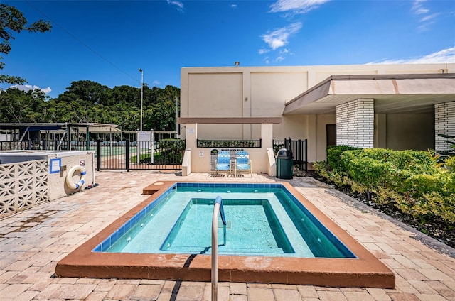 view of swimming pool with a patio