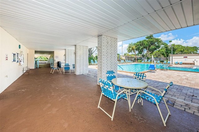 view of patio featuring a community pool