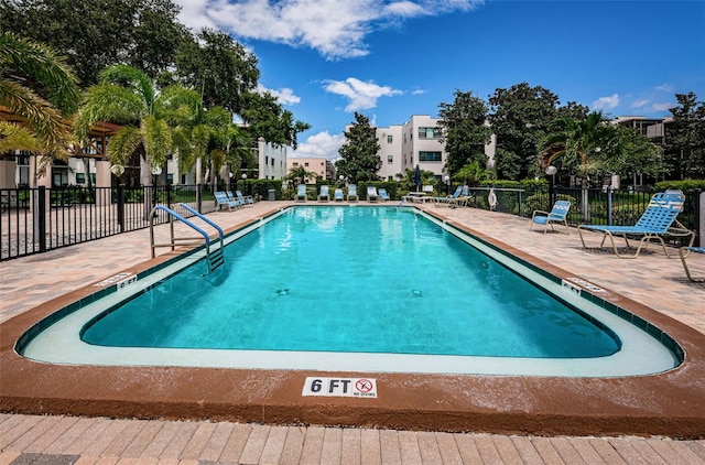 view of swimming pool with a patio area