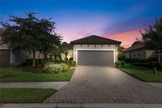 mediterranean / spanish-style house featuring a garage