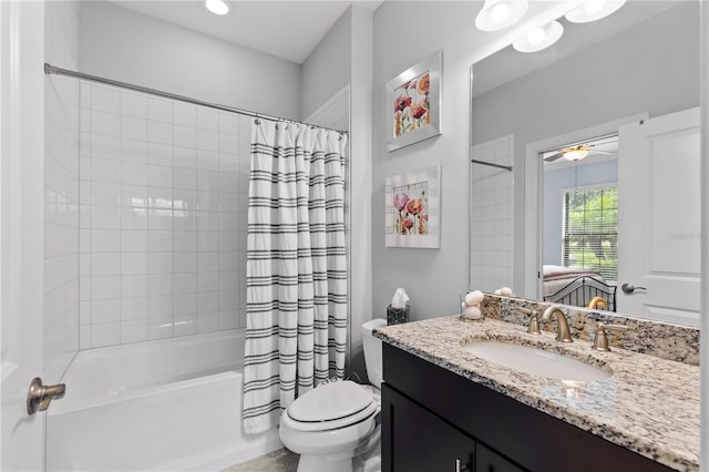 full bathroom featuring ceiling fan, toilet, shower / tub combo with curtain, and vanity