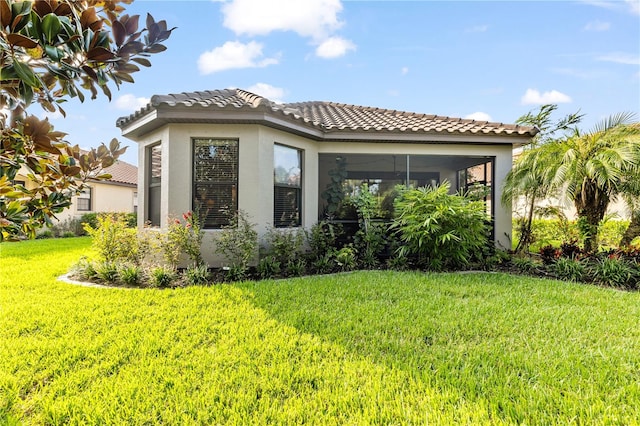 view of home's exterior with a lawn