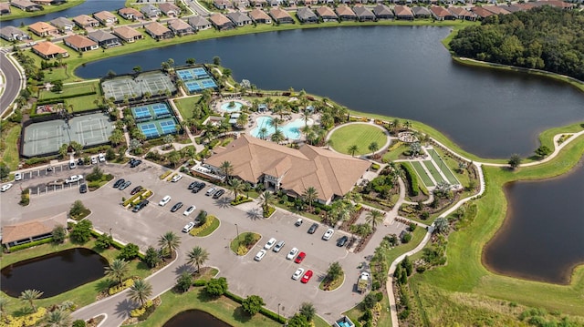 birds eye view of property with a water view