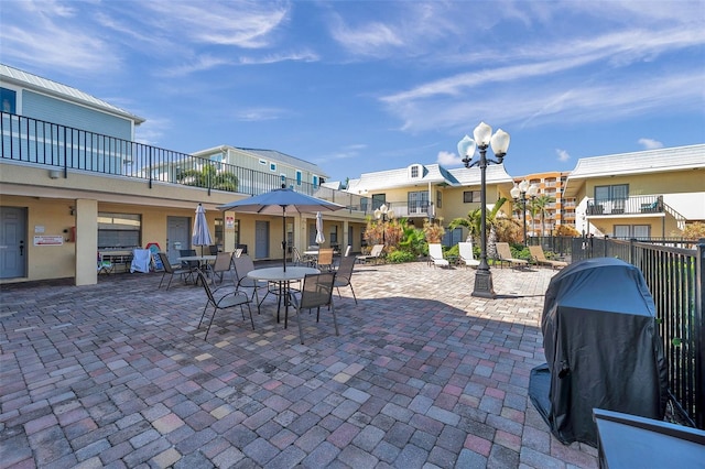 view of patio featuring a balcony