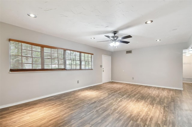 spare room featuring ceiling fan and hardwood / wood-style floors