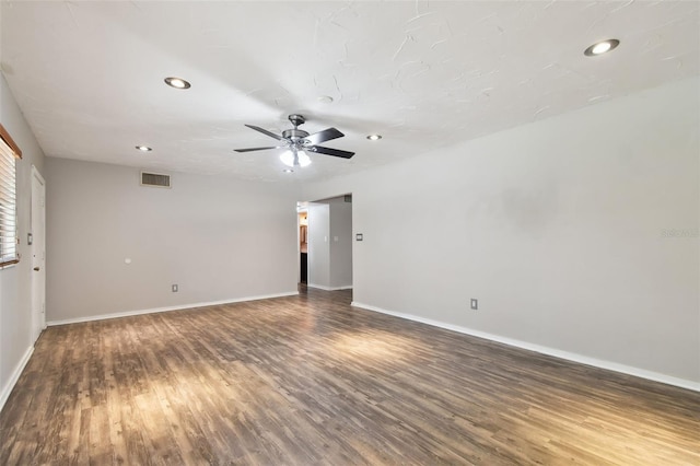 spare room featuring hardwood / wood-style flooring and ceiling fan