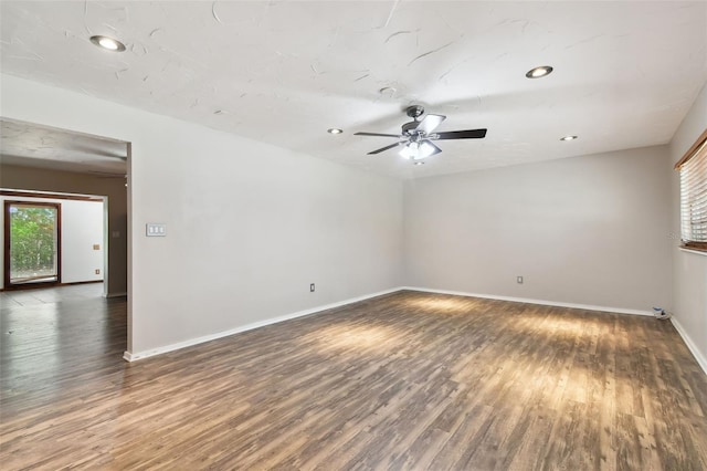 unfurnished room featuring ceiling fan and wood-type flooring