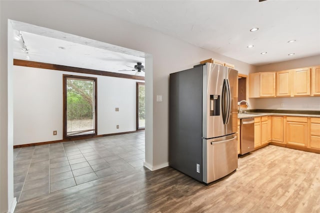 kitchen with ceiling fan, light wood-type flooring, light brown cabinetry, sink, and stainless steel appliances