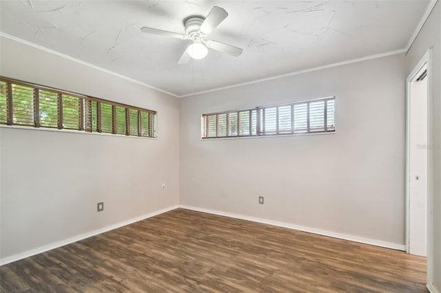 unfurnished bedroom featuring ceiling fan, wood-type flooring, ornamental molding, and multiple windows