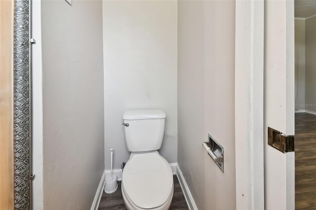 bathroom featuring toilet and wood-type flooring