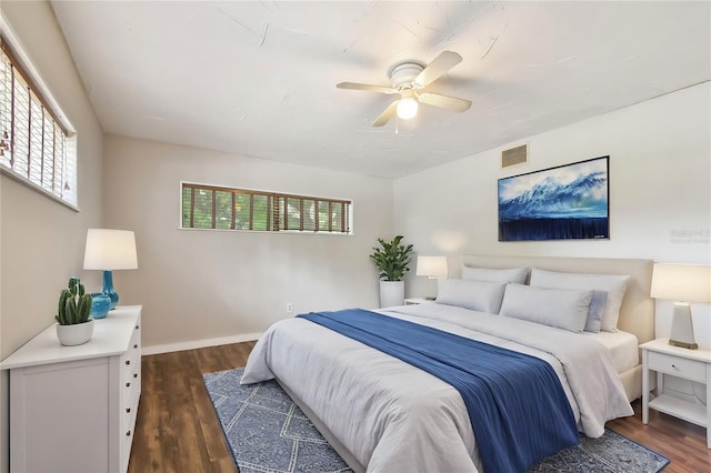 bedroom featuring dark hardwood / wood-style flooring and ceiling fan