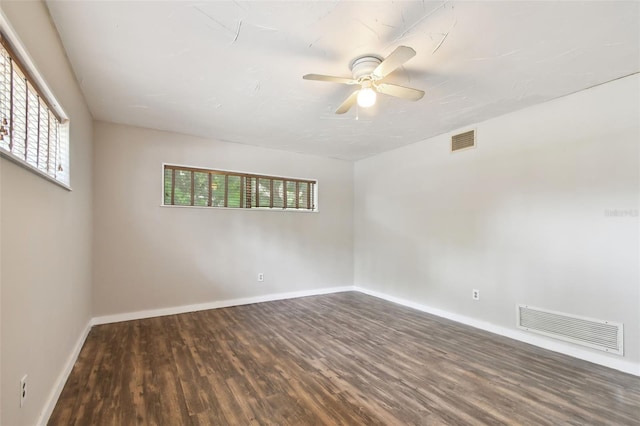 empty room featuring hardwood / wood-style flooring and ceiling fan