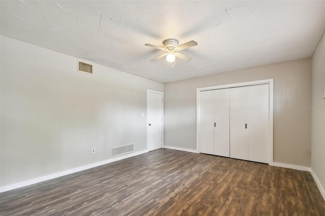 unfurnished bedroom with a closet, ceiling fan, and wood-type flooring