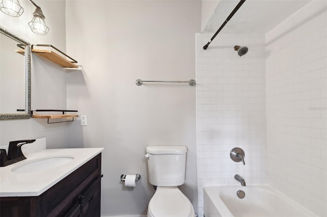 full bathroom featuring tiled shower / bath combo, toilet, and vanity