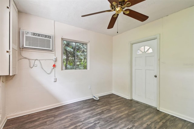 entryway with ceiling fan, dark hardwood / wood-style floors, and a wall mounted air conditioner