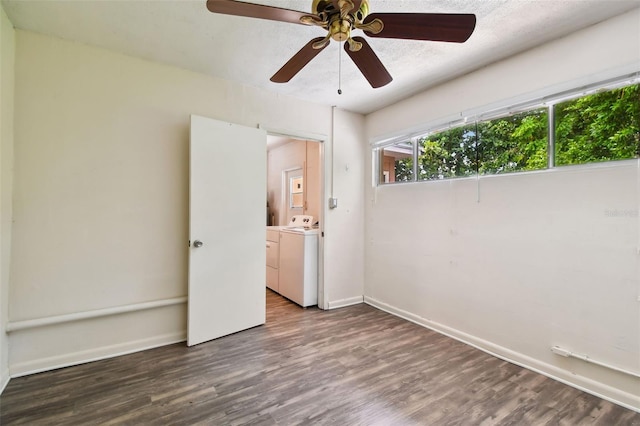 unfurnished bedroom featuring ceiling fan, hardwood / wood-style floors, and washer and clothes dryer