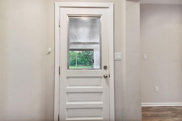 doorway to outside with dark hardwood / wood-style flooring