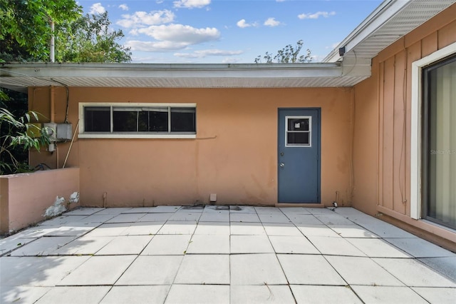 rear view of property featuring a patio area