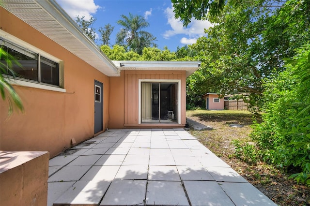 view of patio / terrace with a shed