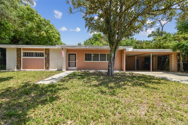 ranch-style house with a carport and a front yard