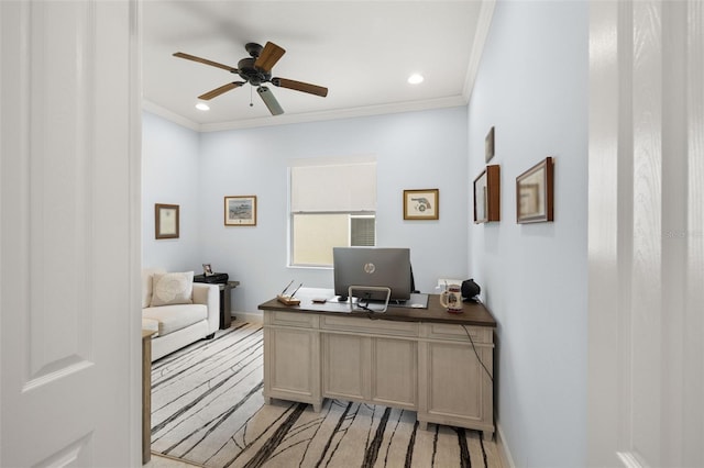 home office featuring ceiling fan, crown molding, and light colored carpet