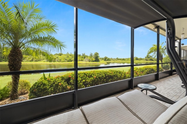 sunroom / solarium with a water view