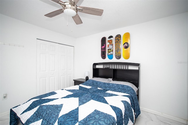 bedroom with ceiling fan and a closet