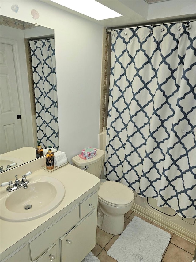 full bathroom with vanity, shower / tub combo, toilet, and tile patterned floors