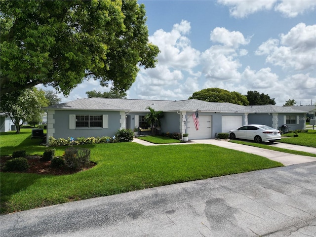 single story home with a front lawn and a garage