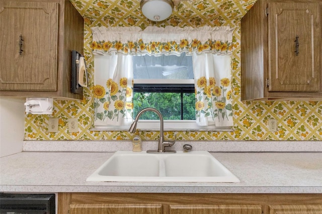 kitchen with decorative backsplash and sink