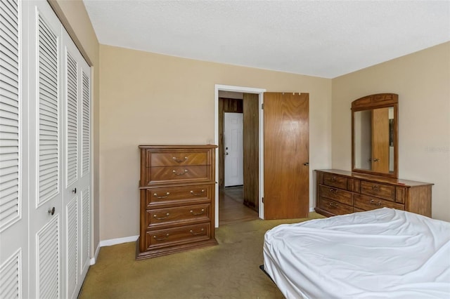 carpeted bedroom featuring a closet