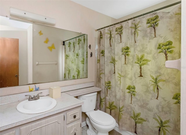 bathroom featuring tile patterned floors, vanity, and toilet