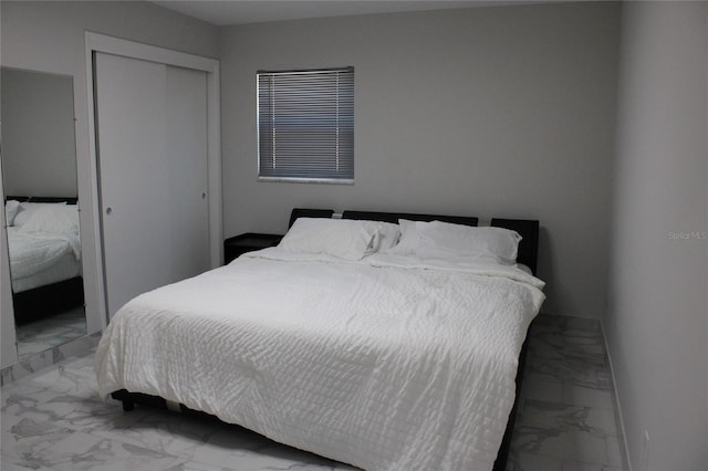 tiled bedroom with a closet