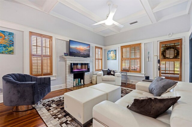 living room with coffered ceiling, hardwood / wood-style floors, ceiling fan, and plenty of natural light