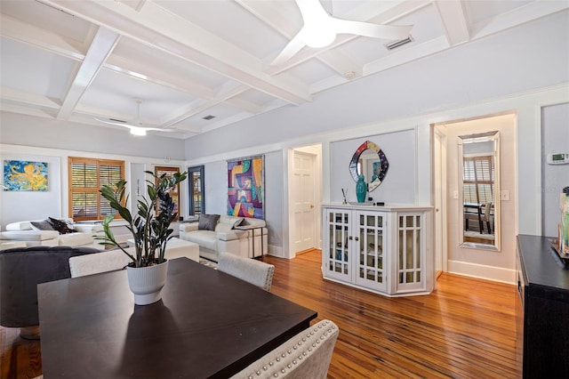 dining room with wood-type flooring, ceiling fan, and a healthy amount of sunlight