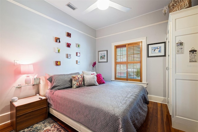 bedroom featuring dark hardwood / wood-style floors and ceiling fan