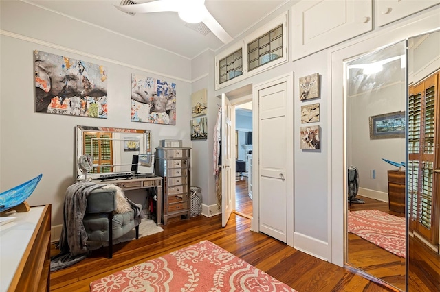 home office featuring ceiling fan, baseboards, and wood finished floors