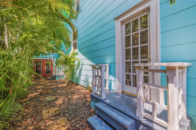 exterior space with wooden walls and french doors