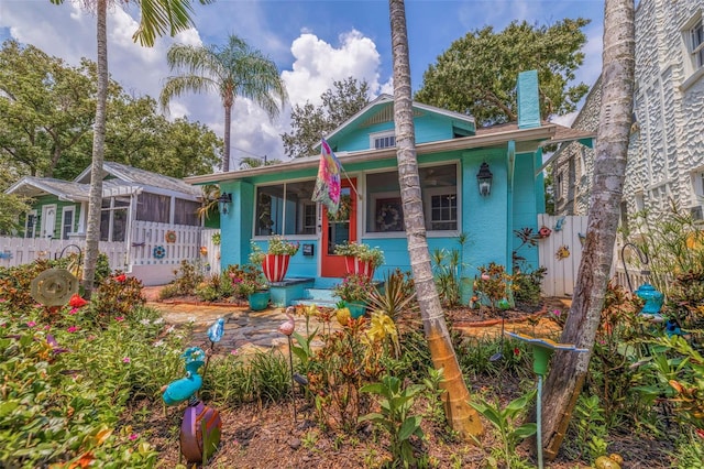 view of front of property featuring a sunroom