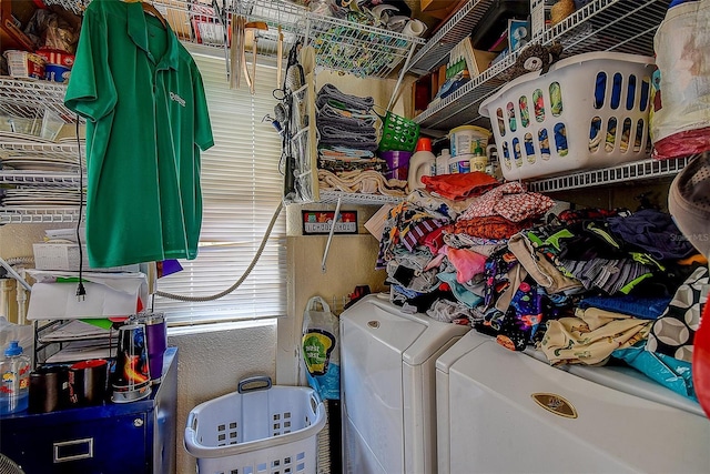 clothes washing area featuring separate washer and dryer