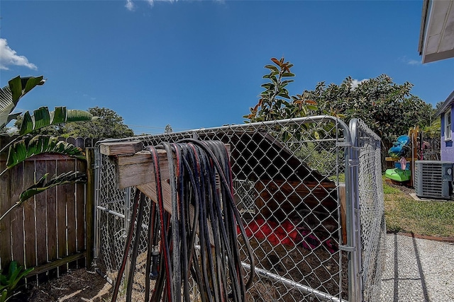 view of gate featuring central AC