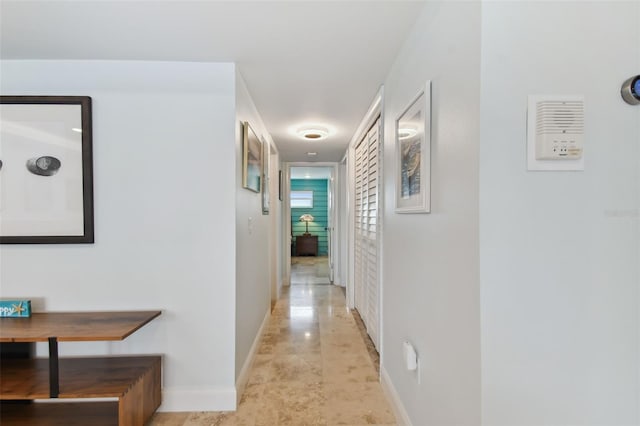 hallway featuring light tile patterned flooring