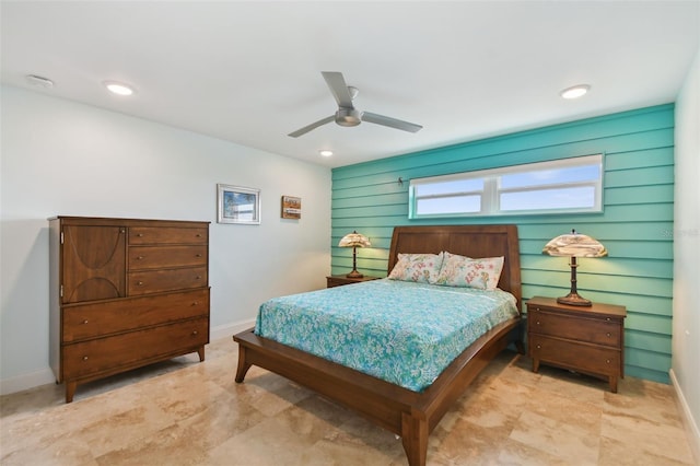 bedroom with ceiling fan and light tile patterned flooring