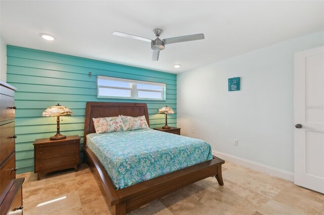 bedroom featuring light tile patterned floors and ceiling fan