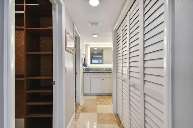 corridor with light tile patterned floors