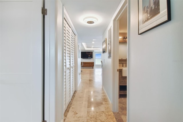 hall featuring light tile patterned floors