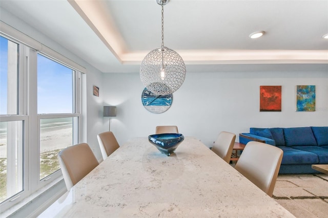 dining area with a tray ceiling