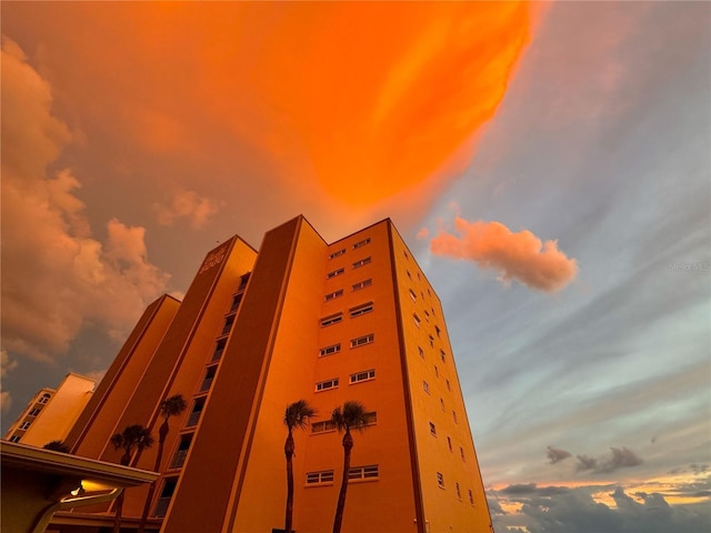 view of outdoor building at dusk