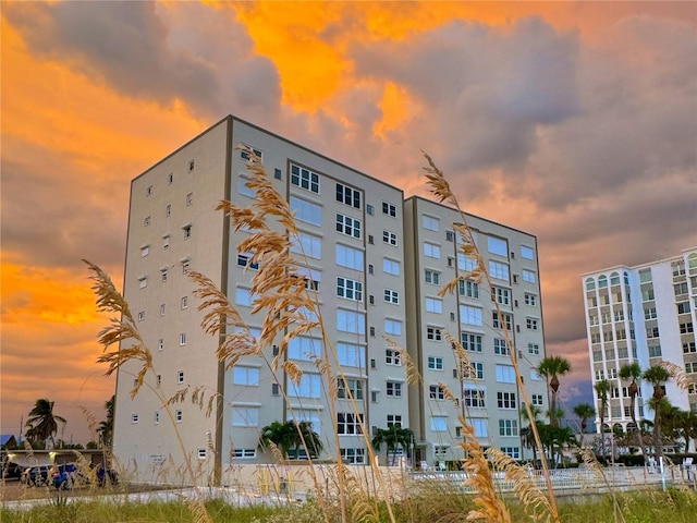 view of outdoor building at dusk