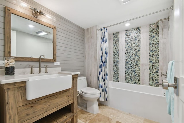 5000 Gulf Blvd Unit 704, St Pete Beach, FL 33706 - full bathroom with toilet, shower / bath combination with curtain, vanity, and wooden walls